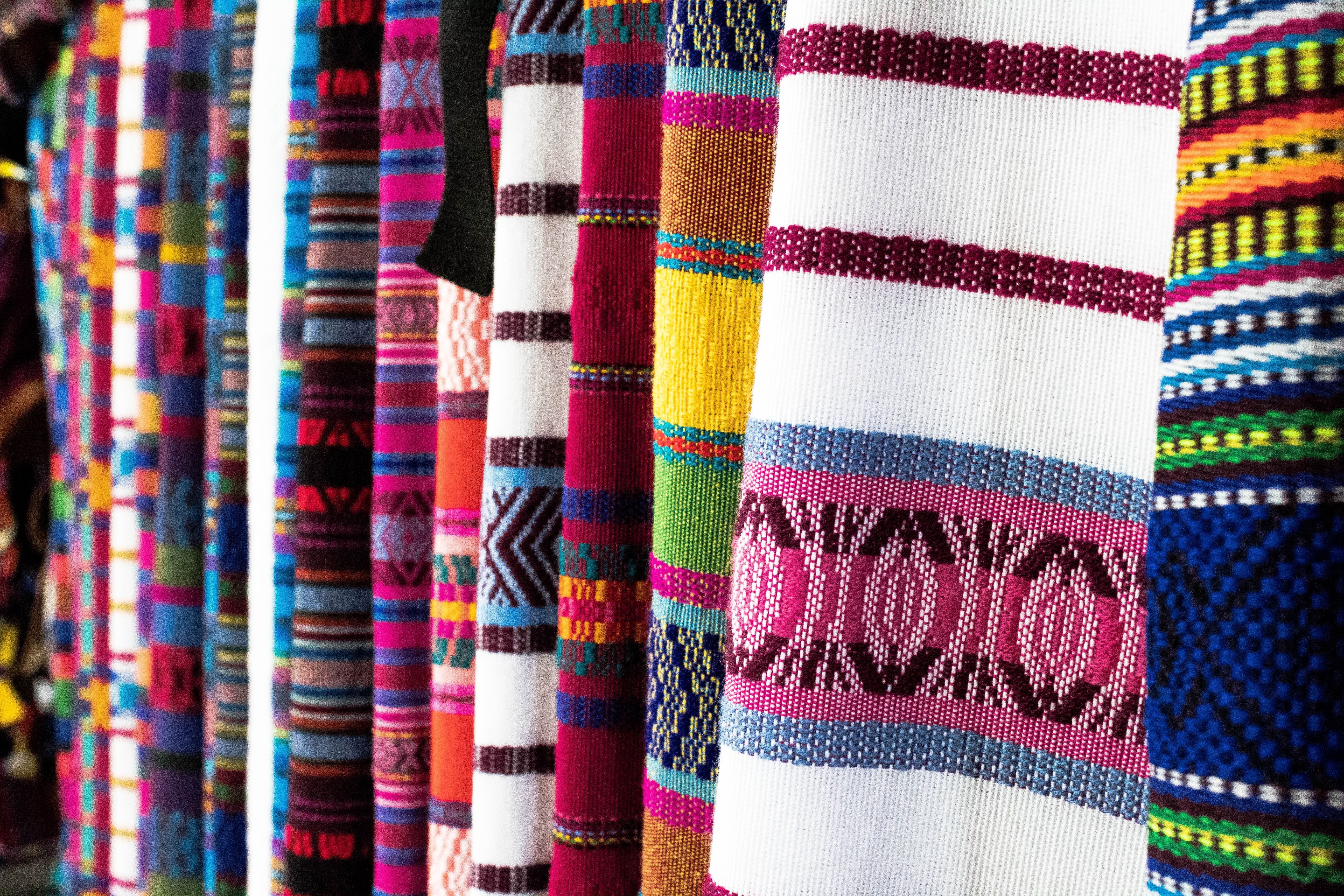 Rolls of cotton fabric and finished garments in the packing hall
